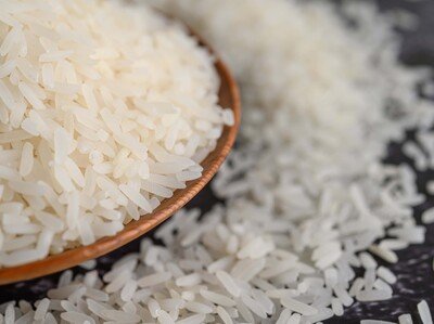 milled-rice-bowl-wooden-spoon-black-cement-floor-e51b6eb0-focus-0-0-400-300